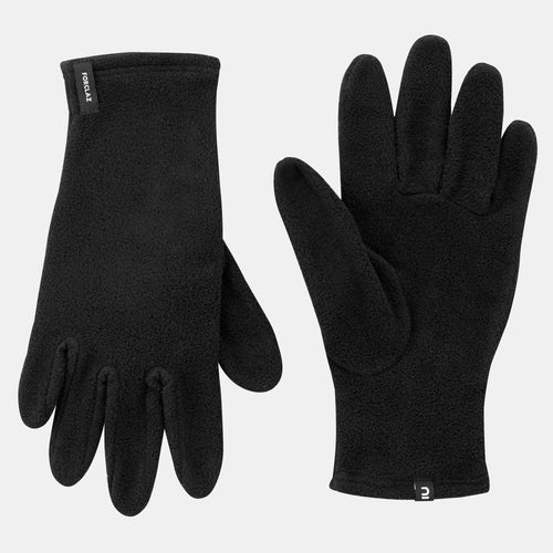 A photo of the Forclaz MT100 Fleece Gloves in use